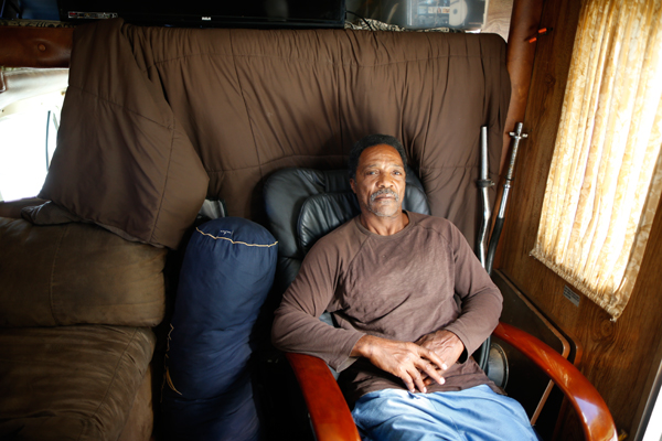 Charles Heard, 58, poses for a portrait in the RV in which he has lived for a year on the streets of Los Angeles, California, United States, November 12, 2015. Los Angeles officials in September declared the rising problem of homelessness an "emergency" in the city and proposed spending $100 million to provide permanent housing and shelters to help the city's 26,000 indigent. The nation's second-largest city has nearly 18,000 individuals living on the streets, as opposed to shelters. REUTERS/Lucy Nicholson