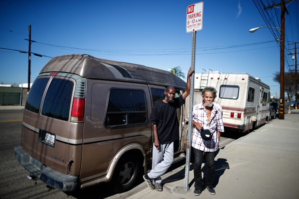 Bernard Leatherwood, 62, (L) and his friend Arthur Johnson, 72, pose for a portrait by the RV in which they live on the streets of Los Angeles, California, United States, November 12, 2015. Leatherwood became homeless seven years ago when he became unable to afford his $1,100 a month rent. Los Angeles officials in September declared the rising problem of homelessness an "emergency" in the city and proposed spending $100 million to provide permanent housing and shelters to help the city's 26,000 indigent. The nation's second-largest city has nearly 18,000 individuals living on the streets, as opposed to shelters. REUTERS/Lucy Nicholson