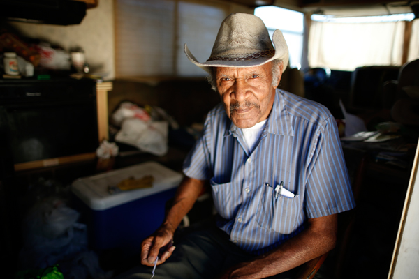Samuel Cole, 85, poses for a portrait in the RV in which he lives on the streets of Los Angeles, California, United States, November 12, 2015. Cole is a retired truck driver who began living in his RV two years ago when he couldn't afford the $100 rise in his rent. Los Angeles officials in September declared the rising problem of homelessness an "emergency" in the city and proposed spending $100 million to provide permanent housing and shelters to help the city's 26,000 indigent. The nation's second-largest city has nearly 18,000 individuals living on the streets, as opposed to shelters. REUTERS/Lucy Nicholson